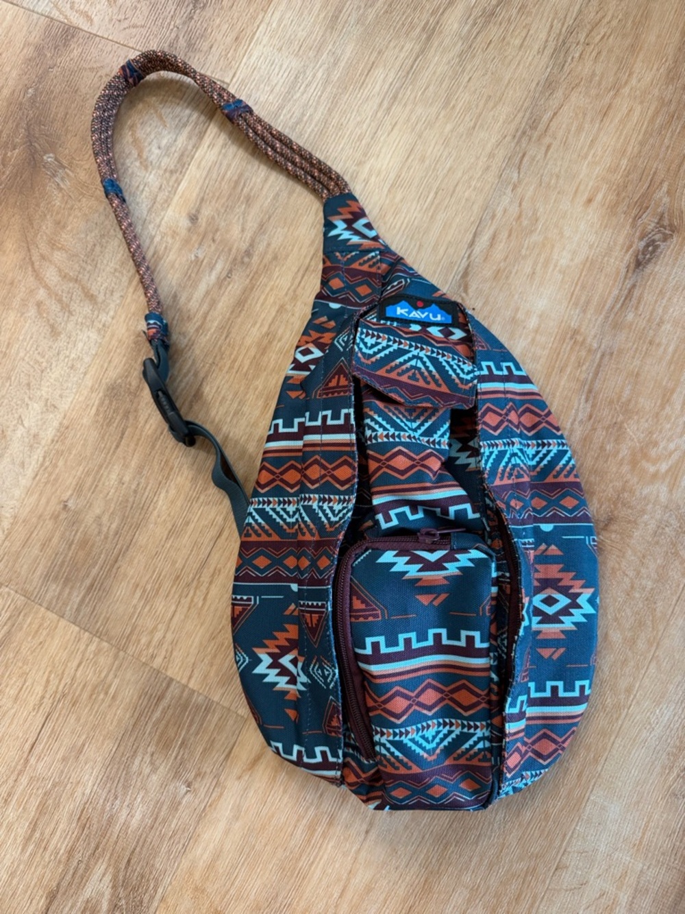 KAVU  Aztec-Print Sling Bag in Teal and Rust